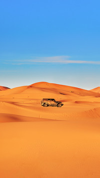 Jeep in Sand Dunes in the Sahara Desert