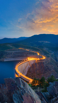 Reservoir dam illuminated at dawn