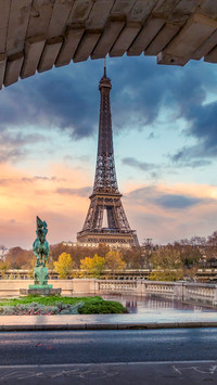 Eiffel tower seen from arch of Bir Hakeim bridge in Paris