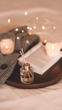 Liquid Home Fragrance in Glass Bottle with Open Paper Book