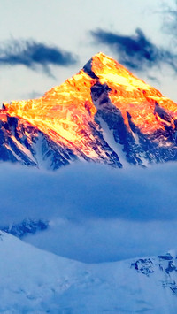 Mount Everest shines brilliantly in the sky.