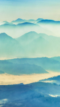 Clouds and mist surround the mountains