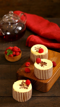 Three chocolate cake with fresh raspberries