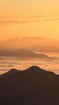 The mountain peak is bathed in the glow of the rosy