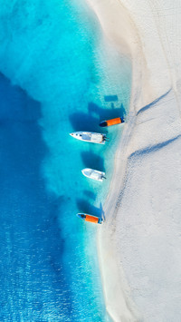 The Yachts and Fishing Boats on Tropical Sea Coast