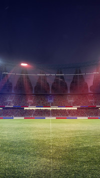 Empty soccer stadium with spotlight and fan tribune