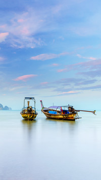 Traditional long-tail boat on the beach in Krabi Thailand