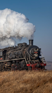 steam locomotive pulling passenger carriages