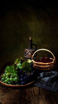 Still life with grapes and raspberry
