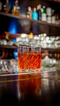 Cocktail Negroni with gin, campari martini rosso and orange
