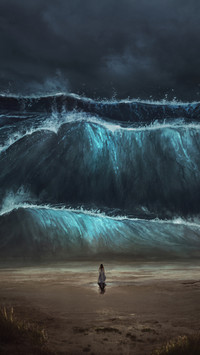 Woman Standing on The Beach Facing The Waves