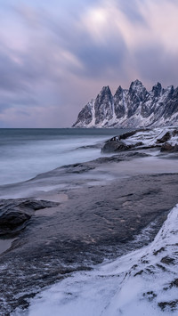 The snowcapped mountain coast of senia island