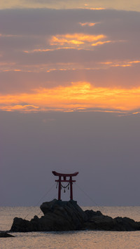 Divine Gateway by the Waves, Embracing the Orange Sky