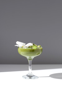 Kiwi smoothie healthy fruit juice served in cocktail glass