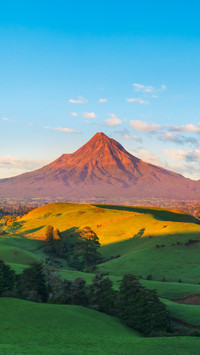 Mount Taranaki Under the Blue Sky with Grass Field