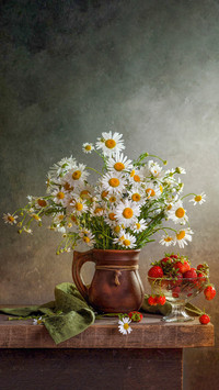 Rustic still life with a bouquet of daisies in a jug