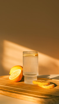 Glass of water with lemon, good morning concept