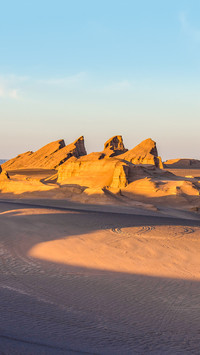 Rock formations in Lut Desert at sunset