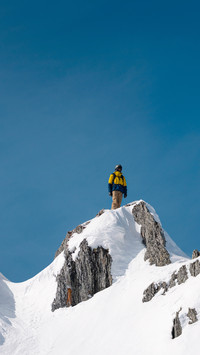 Snowboarder on top of the mountain