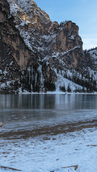 Frozen lake surface tranquil winter scenery