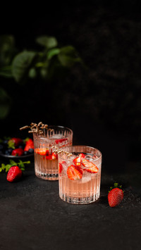 Refreshing Summer Drink with Strawberry Slices in Glasses