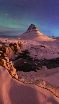 Night view of the Northern Lights Church Mountain in Iceland