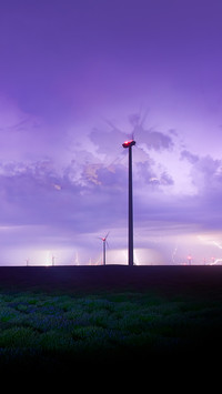 View of endless lavender field under the stormy night sky