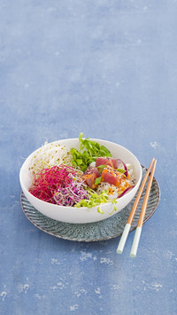 A poke bowl with sprouts and tuna