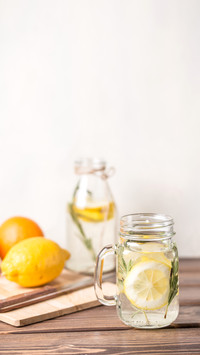 Glass and bottle of frozen homemade lemonade
