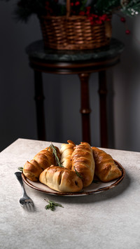 Homemade sausage rolls, on a grey marble table