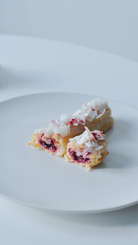 Two pieces of eclair on white plate