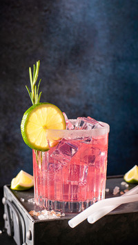 Alcoholic cocktail with tequila and lime in a glass