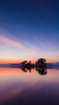 Sunset scene with mirror reflection on a tropical sea