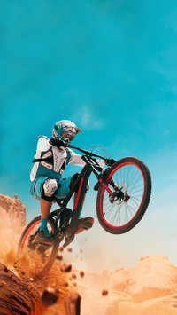 Cyclist riding a bicycle. Downhill