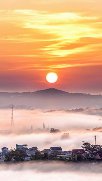 Clouds and mist surround the mountains