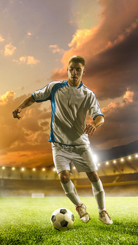 Soccer player in action on sunset stadium background