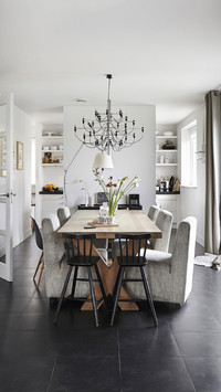 Modern dining set on dark grey tiled floor