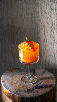 Cocktails on podiums on colored background