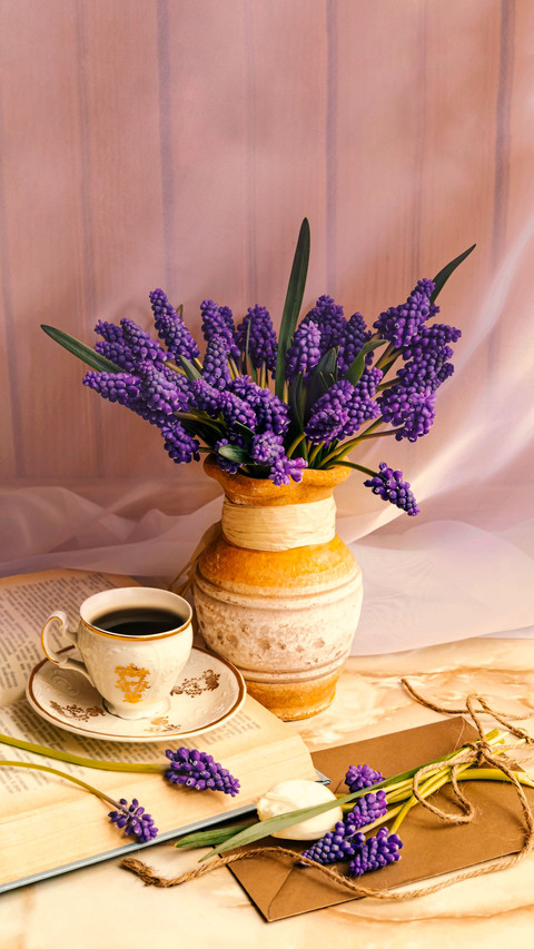 A Cup of coffee, book and romantic flowers preview