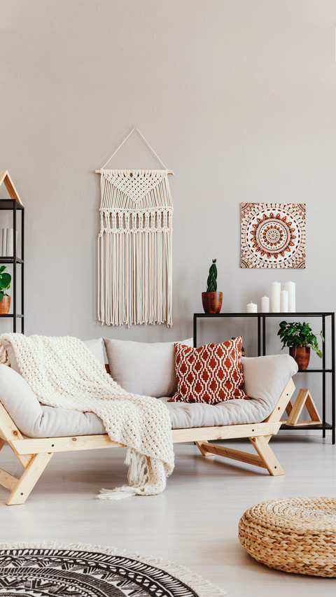 Blanket and cushion on couch in boho living room preview