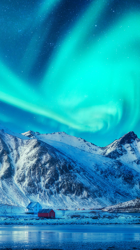 Northern lights above snowy mountains preview