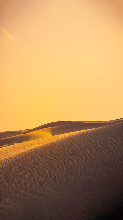 Sand dune during sunset with silhouette preview