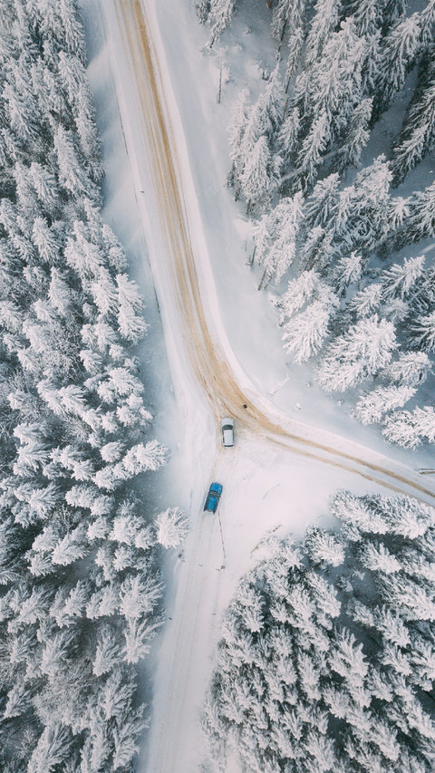 The Car is Driving on A road Covered in Snow preview