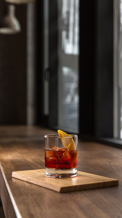 Glass of red fresh alcoholic cocktail with ice preview