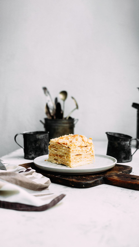 Napoleon cake in a plate on the table preview