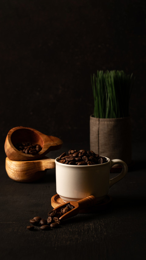 coffee beans that are poured in a glass with the addition preview