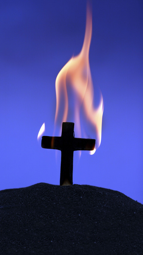 Burning cross on blue preview