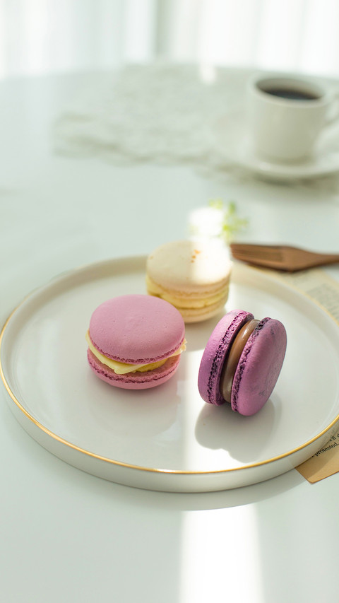 Sweet colorful macarons isolated on white background preview