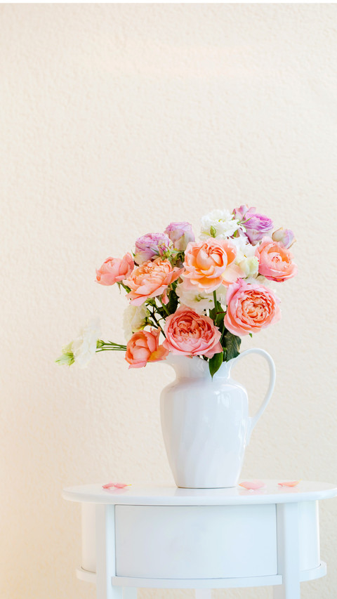 Beautiful roses in ceramic white jug preview