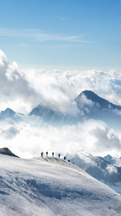 A Group of People Are Climbing The Snow Mountain preview